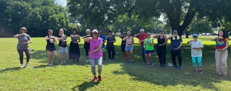 Vicki leading a Tai Chi class in the park