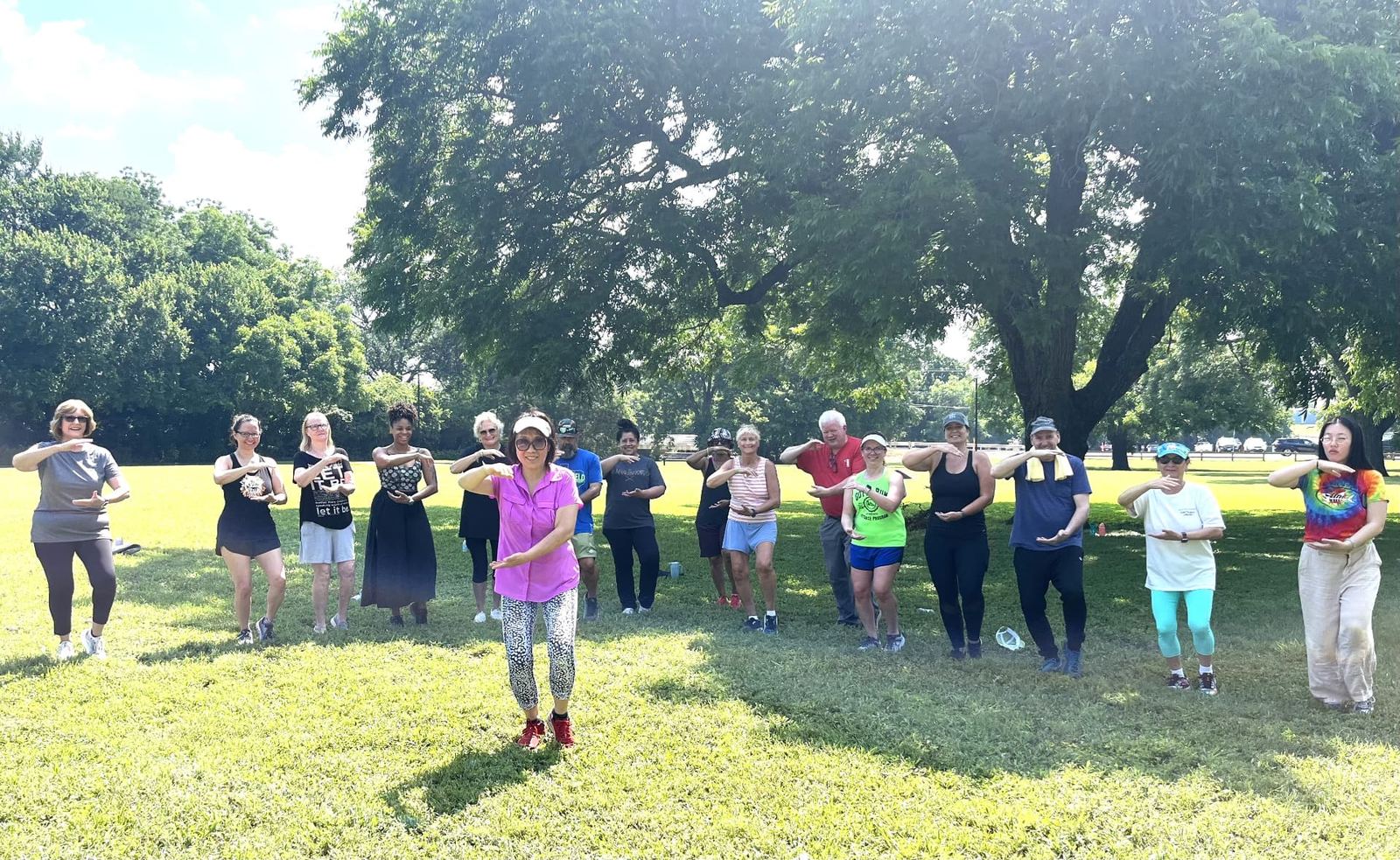 Vicki leading an outdoor Tai Chi class in the park